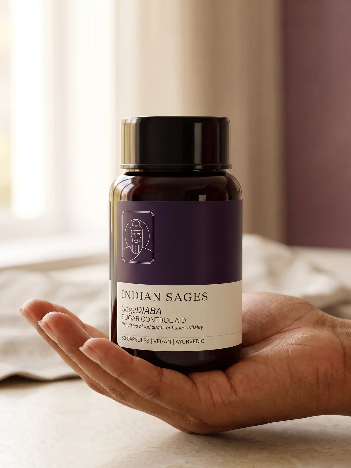 A hand holding a bottle of SageDIABA in soft morning light.
